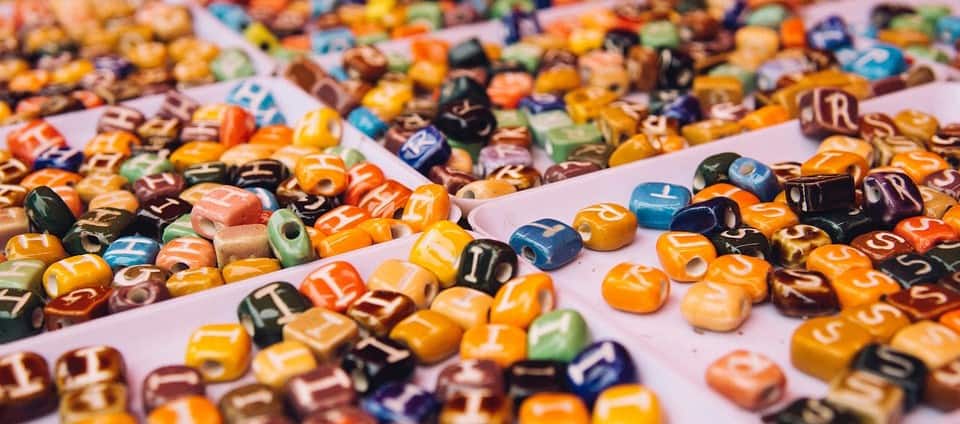 Colorful alphabet beads for kids safety education from "Don't Stick Don't Stuff" book.