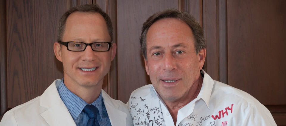 A doctor and a man in a white shirt with handwritten messages and questions, promoting children's safety and health education through "Don't Stick Don't Stuff" book.