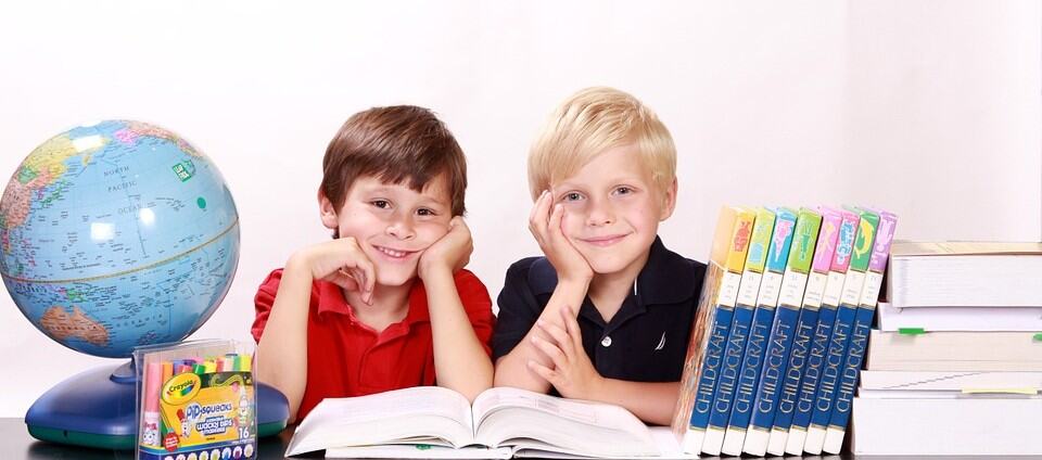 Children reading safety education books from "Don't Stick Don't Stuff" to promote kid safety awareness.
